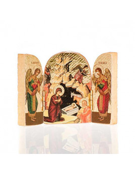 Petit triptyque de la Nativité avec deux anges de chaque côté.