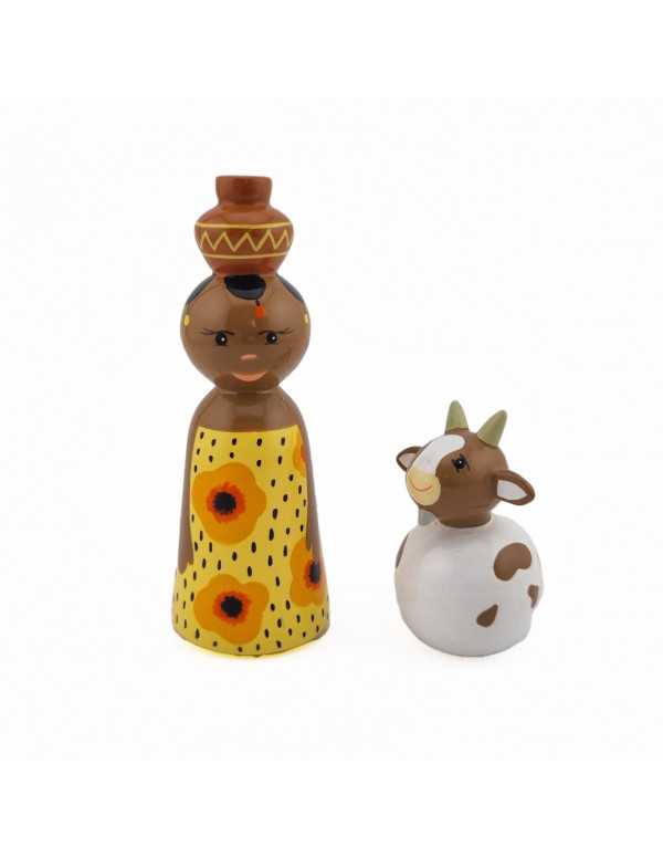 Africaine et sa chèvre en bois tourné et peint à la main, réalisées dans un atelier solidaire aux Philippines.