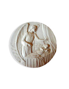 Joli médaillon de berceau en plâtre, avec attache au dos.