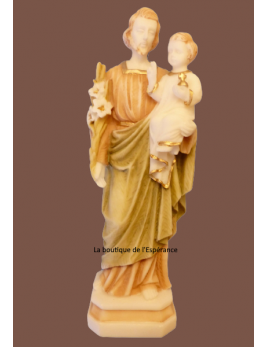 Statue en albâtre colorée de saint Joseph portant l'Enfant Jésus.