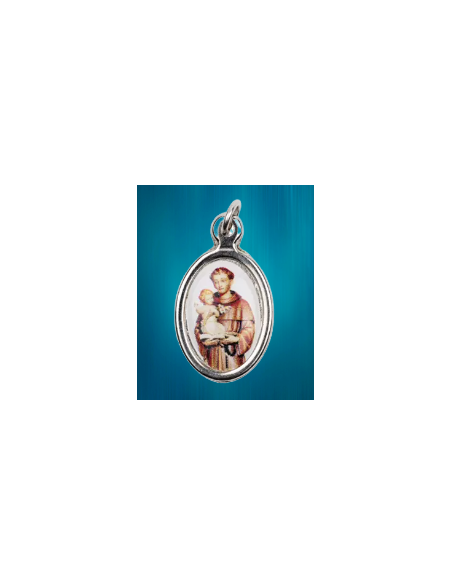 Médaille ovale en métal argenté et résine de saint Antoine portant l'Enfant-Jésus.